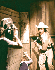 Ron Cedillos on movie set with Chuck Norris